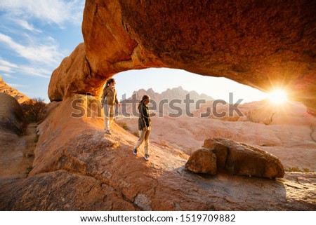Similar – Image, Stock Photo Beautiful sunrise at Damaraland, Namibia. Group of people seen from their back walking up a mountain.
