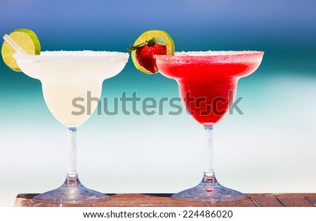 Classic and strawberry margarita cocktails at exotic Mexican beach