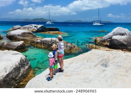 Family of mother and kids enjoying view of beautiful scenery of The Baths beach area major tourist attraction at Virgin Gorda, British Virgin Islands, Caribbean