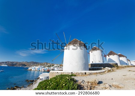 White greek windmills overlooking Little Venice popular tourist destination at traditional village on Mykonos Island, Greece, Europe