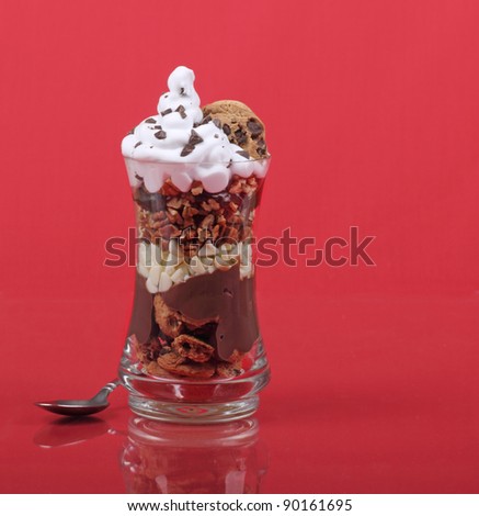 Chocolate nut dessert in a glass with a reflection