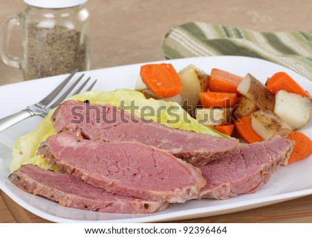 Corned beef and cabbage dinner with vegetables on a dinner plate