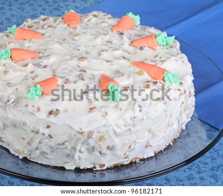 Whole carrot layer cake on a platter