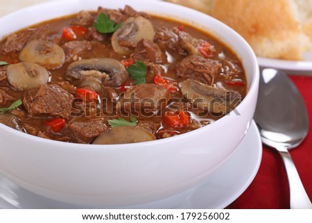 Closeup of beef, mushroom and red pepper soup
