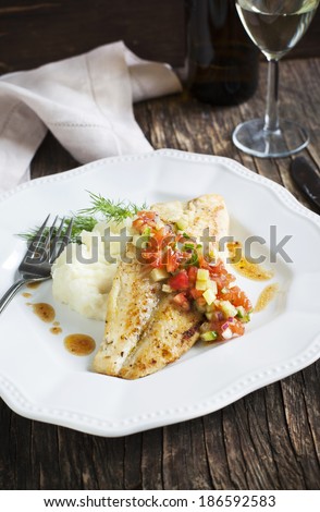 Roasted sea bass fillets with sauce Las Vegas Salsa and mashed potato