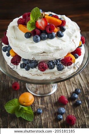 Meringue cake with fresh berries. Pavlova cake