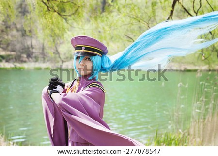TORONTO - MAY, 8 : Caucasian girl wearing Hatsune Miku Cosplay Japanese anime character cosplay pose on May 8, 2015 at High Park, Toronto