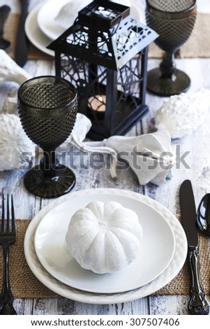 Halloween table decoration in black and white colors