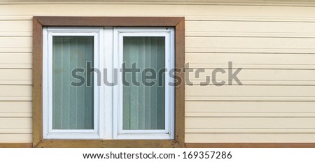 White wooden windows on stack wooden wall