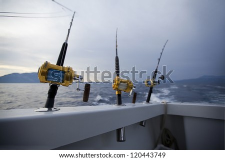 Fishing gears and fisherman boat sailing away in open sea