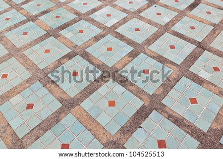 The tiles are arranged on the cement floor.