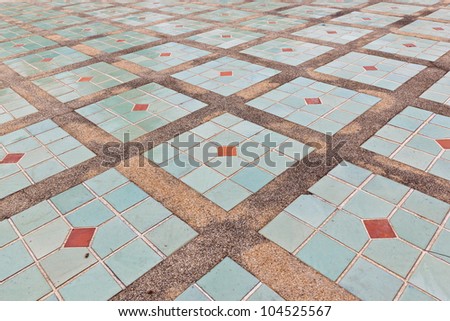 The tiles are arranged on the cement floor.