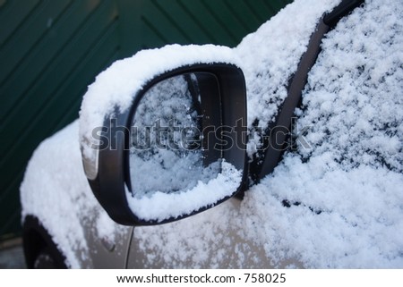 Wing mirror covered in snow