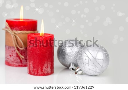 Christmas decoration with red candles and silver christmas balls