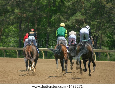 Horses and riders slowing down after the race