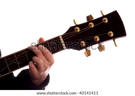 Acoustic guitar with person\'s fingers playing G Major chord