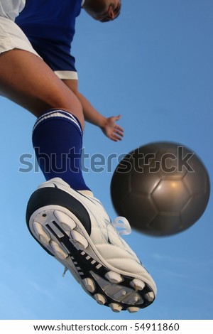soccer,kick,ball,play,player,game,shoe,sport,sock,fun,cleats,football,blue,white,caucasian,movement,arms,balanced,green,grass