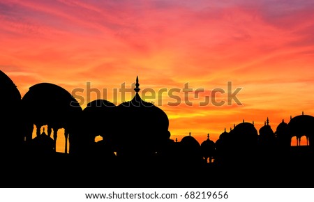 Silhouette of rich palace and temple at sunset, Shekhawati, Rajasthan, India.