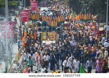 VADODARA, GUJARAT/INDIA - 9 April 2014 : Large crowd walking with Gujarat Chief Minister and BJP prime ministerial candidate Narendra Modi  on 9th april in Vadodara, Gujarat.