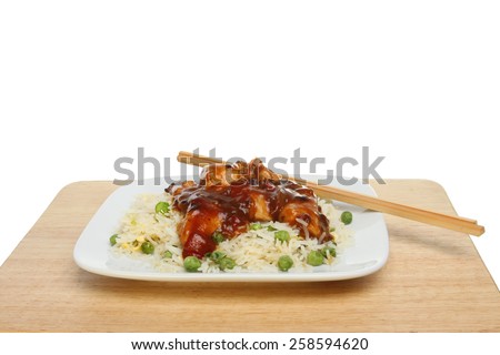 Chinese meal with chopsticks on a plate