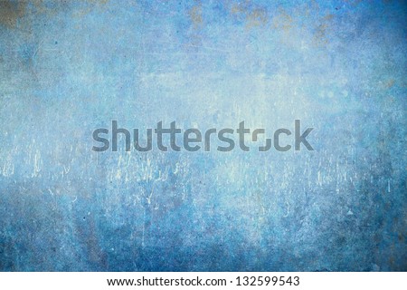 Grunge blue background with faded central area for copy space.