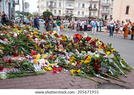 Kiev, Ukraine - July 18, 2014. People brought flowers and toys to the embassy of the Netherlands after the Malaysia Airlines B-777 (MH17) was shot down over Donetsk Region.