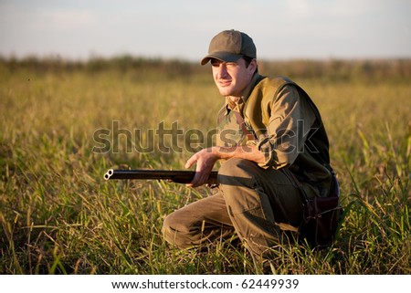 Hunter waiting silently for the hunt during the hunting season