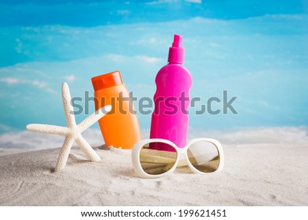 Collection of beach items on the beach against blue sky