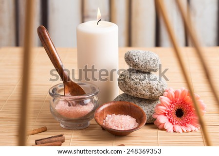 Aromatherapy and bath accessories; zen stones, flower, white candle, scrub, cinnamon