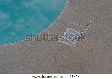 pool chair against blue waters