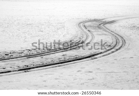 winter scene with curved tracks in snow