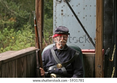 Confederate soldier off to battle on a open air train .