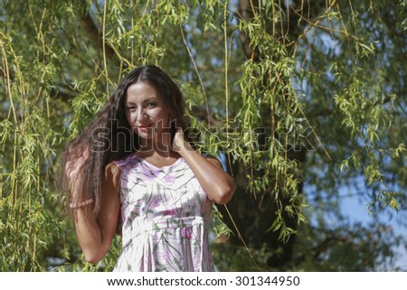 Intelligent woman against the backdrop of nature rests