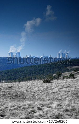 nuclear power plant in the middle of nature as a symbol of destruction