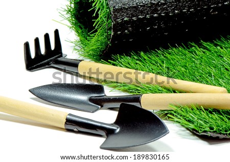 Small Gardening Tools and Artificial Turf  Isolated on White Background.