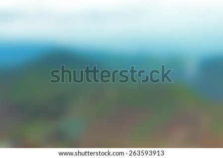 Blurred Background of Bright Sky on the Mountain Top in Daylight. Blurred Blue and Green of Nature Background.