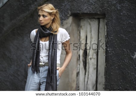 A young woman near a mysterious old door
