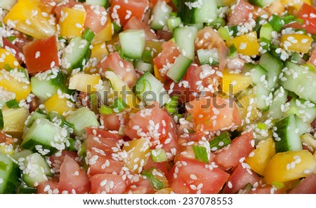 Vitamin vegetable salad slices with sesame seeds close-up