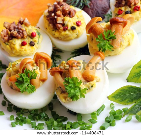 Eggs stuffed with boiled egg yolk, fried onions and mushrooms