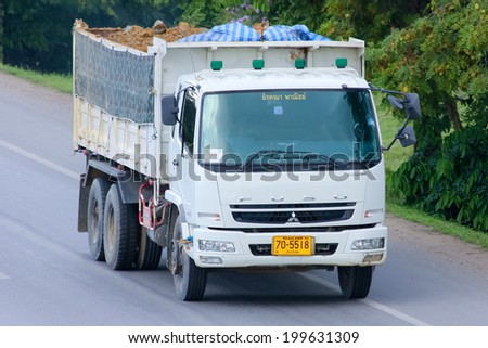 CHIANGMAI, THAILAND- MAY 21 2014:  Dump truck of Akana commerce company. Photo at Road No.11 about 5 Km from Chiangmai city.