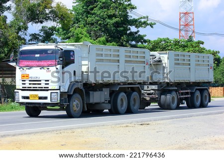 Chiangmai, Thailand - October 1, 2014: Trailer dump truck. Photo at road no.121 about 8 km from downtown Chiangmai, thailand.