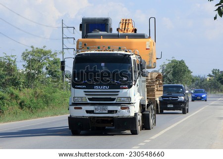 CHIANGMAI, THAILAND - NOVEMBER 14 2014: Private truck and backhoe. Photo at road no.121 about 8 km from downtown Chiangmai, thailand.