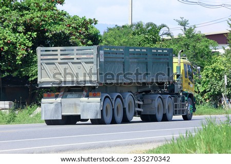 CHIANGMAI, THAILAND - OCTOBER 2 2014:  Trailer dump truck  of stone one public company limited. Photo at road no.121 about 8 km from downtown Chiangmai, thailand.
