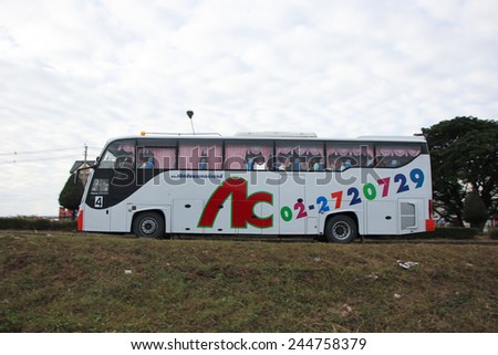 CHIANGMAI, THAILAND - DECEMBER  3 2014: School bus of Cherdchai transport company. Photo at road no.121 about 8 km from downtown Chiangmai, thailand.