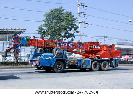 CHIANGMAI, THAILAND - DECEMBER 19 2014:  TADANO Crane Truck of CHANGTHONG Crane Company. Photo at road no 1001 about 8 km from downtown Chiangmai, thailand.