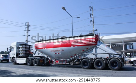 CHIANG MAI, THAILAND - DECEMBER  25 2014:   Cement truck of Phadungrit Transport.  Photo at road no.1001 about 8 km from city center, thailand.