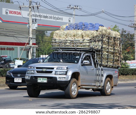 CHIANGMAI , THAILAND -FEBRUARY 13 2015:  Private Pick up truck. Photo at road no 1001 about 8 km from downtown Chiangmai, thailand.