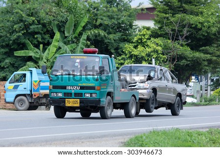 CHIANGMAI , THAILAND -AUGUST 6 2015:   SayThong Tow truck for emergency car move. Photo at road no 1001 about 8 km from downtown Chiangmai, thailand.