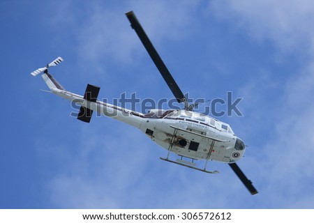 CHIANGMAI, THAILAND -AUGUST 8 2015:  1712 Bell 205,  UH-1 of Royal Thai Police Wing. Fly Over road no 121 about 8 km from downtown Chiangmai, thailand.