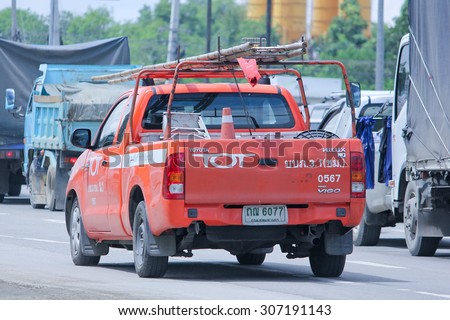 CHIANGMAI, THAILAND -AUGUST 8 2015:  Pickup truck of Tot company.Intenet and Telephone Service in Thailand. Photo at road no.121 about 8 km from downtown Chiangmai, thailand.